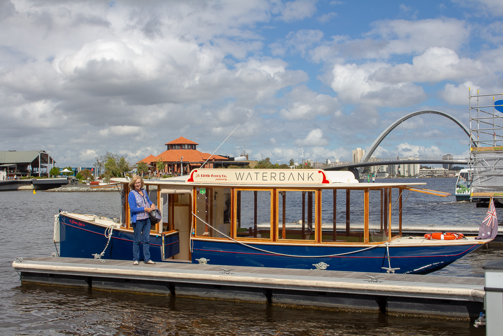 Estelle standing beside Little Ferry Co ferry, on Swan River Perth