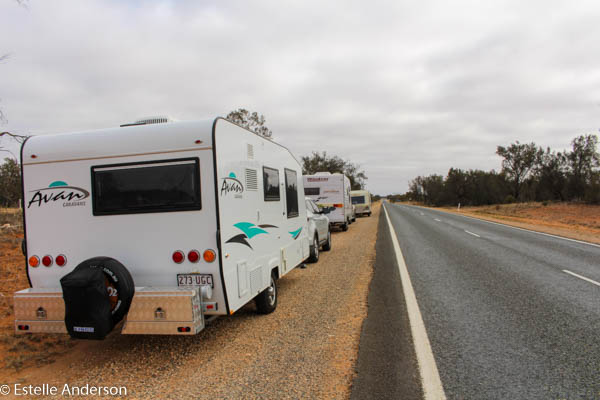 Three caravans beside the road on their way to Broken Hill
